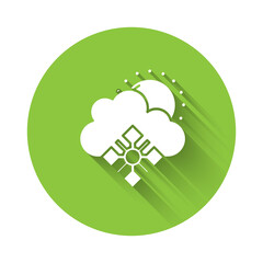 White Cloud with snow and sun icon isolated with long shadow. Cloud with snowflakes. Single weather icon. Snowing sign. Green circle button. Vector.