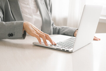 Portrait of a businesswoman using laptop.