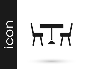 Black Picnic table with chairs on either side of the table icon isolated on white background. Vector.