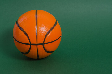 Basketball ball on a green background with copy space. basketball matches.