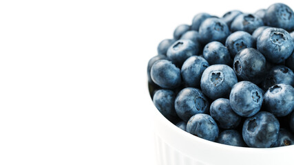 Blueberries in a white Cup on a white background. Isolate, free space