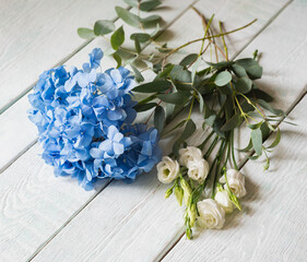 bouquet with blue hydrangea, white roses and eucalyptus