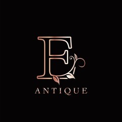 Gold Rose E Luxury Letter Logo Template Design. Monogram antique ornate nature floral leaf with initial letter logo gold rose color