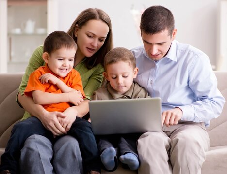 Young family surfing internet and looking at photos