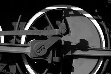 detail of old steam locomotive wheel in black and white 