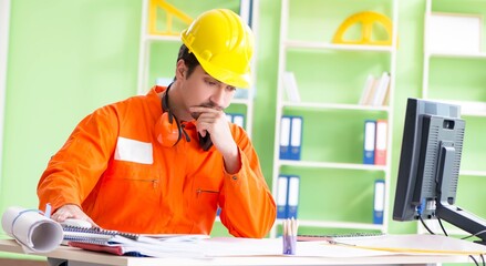 Construction supervisor planning new project in office