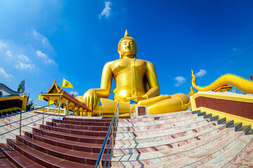 Beautiful of Large golden sitting Buddha statue with background of blue sky at Wat Muang  temple ,Ang Thaong,Thailand