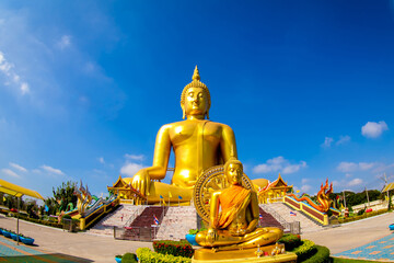 Beautiful of Large golden sitting Buddha statue with background of blue sky at Wat Muang  temple ,Ang Thaong,Thailand