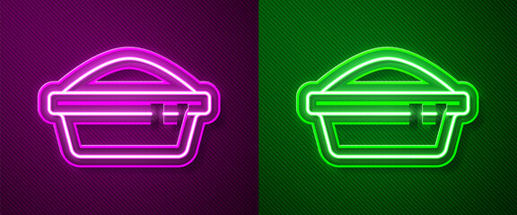 Glowing neon line Pet food bowl for cat or dog icon isolated on purple and green background. Dog or cat paw print. Vector.