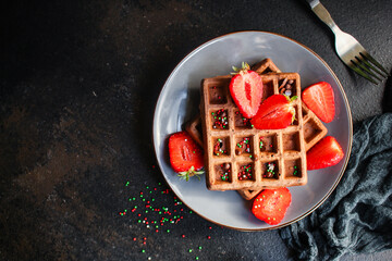Belgian waffles sweet dessert serving size. food background top view copy space for text organic eating