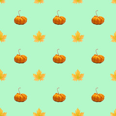 Simple seamless pattern with pumpkin and autumn leaves