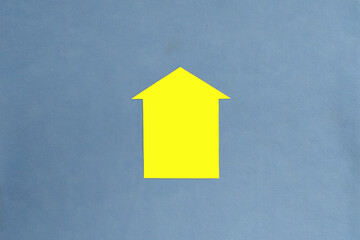 The house is yellow on a blue background. Real estate, home sales, mortgages.