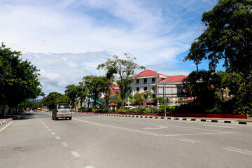 Fototapeta na wymiar view of city at langakawi with road, car building, trees and beautiful nature