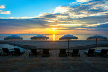 Fototapeta na wymiar Relax on the beach canvas chair in the morning light