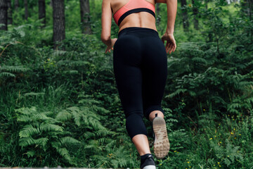 body of a girl running through the woods
