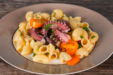 Pasta with octopus and yellow tomatoes