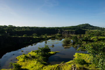 Fototapeta premium Panoramic view of lush green Vetal Hill in Pune, India
