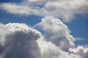 Fototapeta na wymiar Blue sky with beautiful Cumulus clouds Sunny summer day close up, environment scene