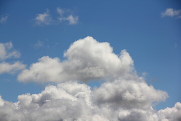 Blue sky with beautiful Cumulus clouds Sunny summer day close up stratosphere view