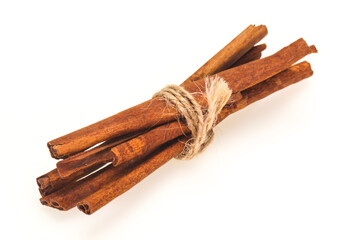 Cinnamon sticks heap isolated on white