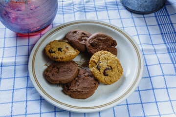 Traditional homemade chocolate chip cookies and cranberry biscuits on plate