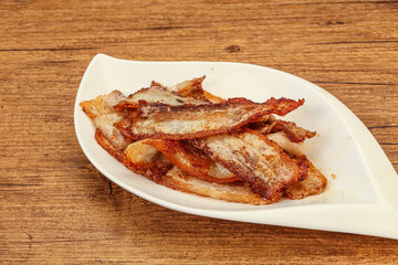 Roasted juicy bacon in the plate