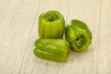 Three green bell juicy peppers