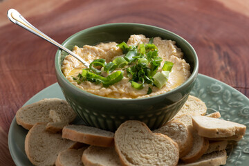 Chickpea paste in the bowl and toast