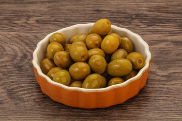 Green pickled olives in the bowl