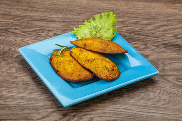 Baked potato with herbs and spices