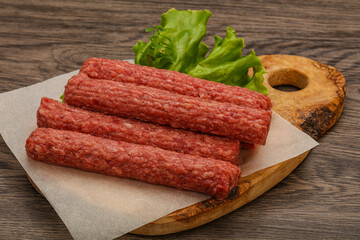 Raw beef sausages with spices