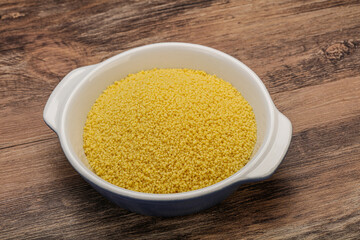 Raw cous cous heap in the bowl