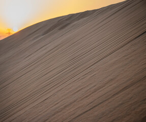 Closeup shot of a sand dune during sunset