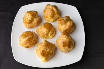 Puff pastries organized on a plate - View from above.