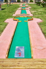 Miniature golf course in hotel. Entertainment for tourists at hotel