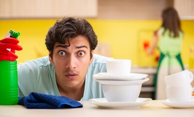 Young couple working at kitchen