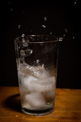 Old soda, glass and ice