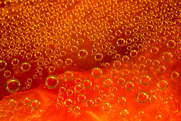 Water drops. Condensate. Macro photo. Orange abstract background made of drops. Beer texture...