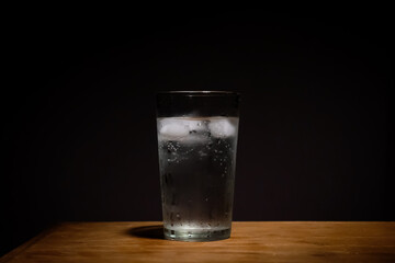 Old soda, glass and ice