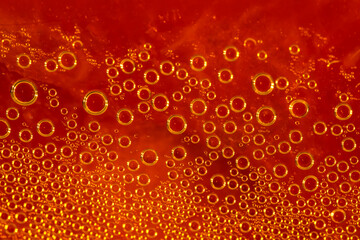 Water drops. Condensate. Macro photo. Orange abstract background made of drops. Beer texture close-up. Raindrops on an orange surface. Orange texture of dew drops on the surface. Drops close up.