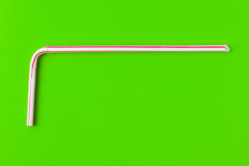 tubes for drinks on a green background macro. place for the label