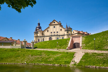 Fototapeta na wymiar Nesvizh castle in summer day with blue sky. Tourism landmark in Belarus, cultural monument