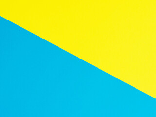 colored paper background in yellow and blue. Top view
