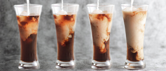 milk is being filled to ice coffee, beautiful and fantastic shapes occurs with copy space