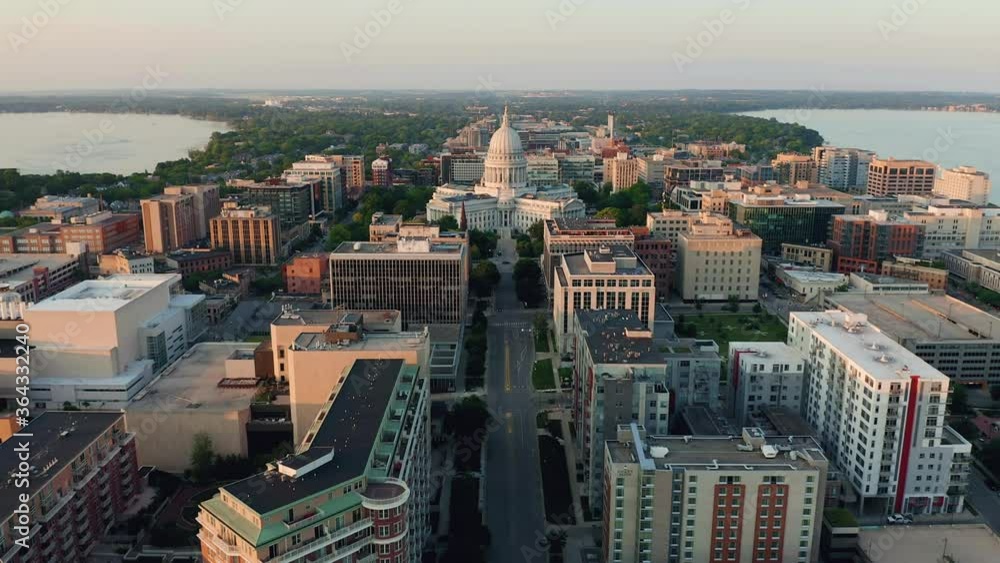 Poster aerial overhead view of street leading to madison city center and capitol building. warm sunset ligh