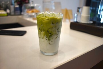 Iced green tea milk  in a cafe