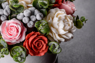 Bouquet of beautiful bright rose flowers in a gift cylindrical cardboard box