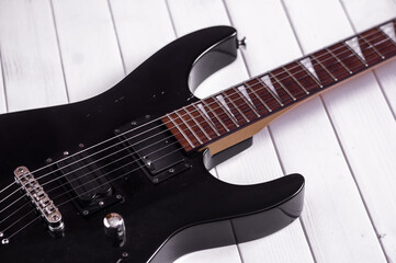Fototapeta na wymiar electric guitar on the black background