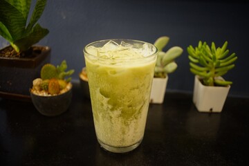 Iced green tea milk  in a cafe