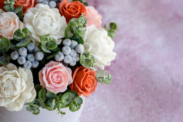 Bouquet of beautiful bright rose flowers in a gift cylindrical cardboard box